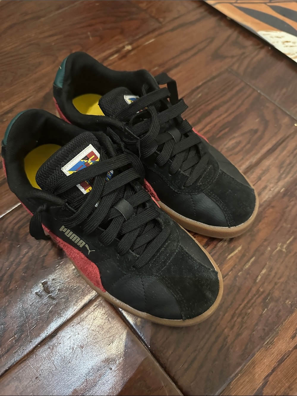 Puma Black Sneakers with Red Accents and Gum Outsole
